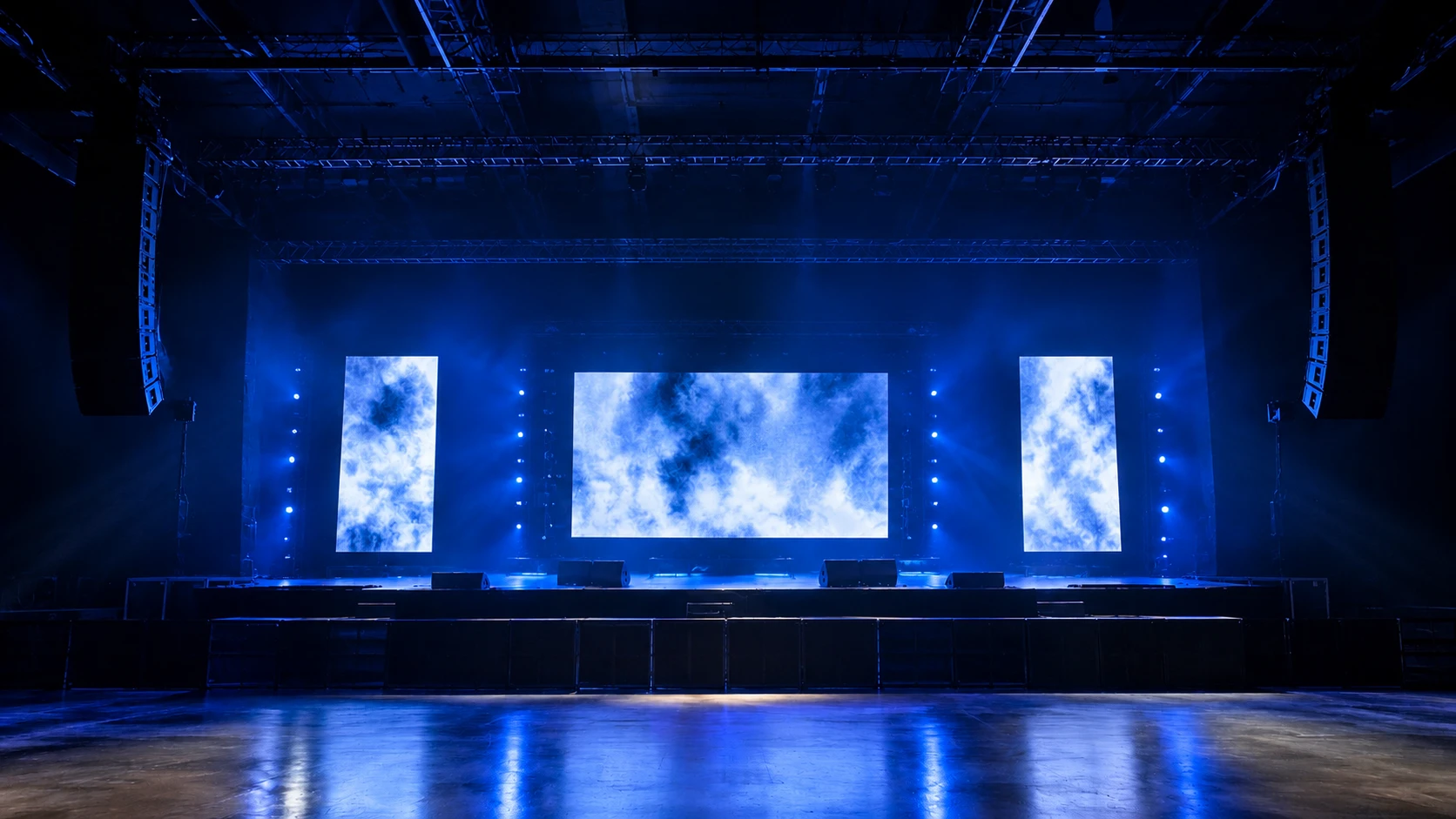 Stage with a lighting truss and moving head lights, lit by Illumination Tec Design